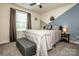 Charming bedroom features a comfortable bed, stylish color blocking, and a window at 11951 Old Statesville Rd, Huntersville, NC 28078