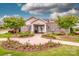 Clubhouse entrance with manicured flower beds and walkway at 11951 Old Statesville Rd, Huntersville, NC 28078