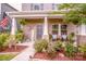 Inviting front porch with brick columns, seating, and well-maintained landscaping at 11951 Old Statesville Rd, Huntersville, NC 28078