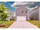 Detached two-car garage with driveway and green lawn at 11951 Old Statesville Rd, Huntersville, NC 28078