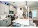 Bright kitchen featuring an island with a sink and seating, stainless steel appliances, and ample storage at 11951 Old Statesville Rd, Huntersville, NC 28078