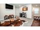 Inviting living room features a cowhide rug, stylish decor, and comfortable seating at 11951 Old Statesville Rd, Huntersville, NC 28078