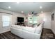 Bright living room featuring a neutral color palette, large windows, and stylish decor at 11951 Old Statesville Rd, Huntersville, NC 28078