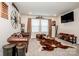 Comfortable living room includes a leather sofa, mounted TV, and unique decorative elements at 11951 Old Statesville Rd, Huntersville, NC 28078