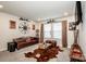 Comfortable living room features a leather sofa, area rug, and mounted television at 11951 Old Statesville Rd, Huntersville, NC 28078