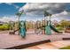 Community playground featuring slides, climbing wall, and play structures on a soft wood chip surface at 11951 Old Statesville Rd, Huntersville, NC 28078