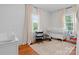 Bright Bedroom featuring hardwood floors and a white crib at 1211 11Th Nw St, Hickory, NC 28601
