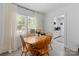 Dining room showcasing hardwood table/chairs and bright natural light at 1211 11Th Nw St, Hickory, NC 28601