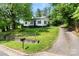 Charming single-story home with a well-maintained lawn and a quaint front porch at 1211 11Th Nw St, Hickory, NC 28601