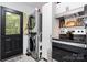 Kitchen features modern stainless steel appliances and stacked washer/dryer at 1211 11Th Nw St, Hickory, NC 28601