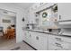 Traditional white kitchen featuring shaker cabinets, updated sink and fixtures, and ample storage space at 1211 11Th Nw St, Hickory, NC 28601
