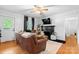Inviting living room showcasing a fireplace, hardwood floors, and comfortable seating at 1211 11Th Nw St, Hickory, NC 28601