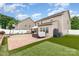 A beautiful paver patio with a hot tub, and yard offering multiple areas for recreation and relaxation at 12822 Plumleaf Dr, Charlotte, NC 28213