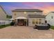 Enjoy outdoor living with a large patio, gazebo, and hot tub in this home's private backyard at 12822 Plumleaf Dr, Charlotte, NC 28213