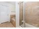 Bathroom featuring tub and glass enclosed tiled shower with tile flooring and walls at 12822 Plumleaf Dr, Charlotte, NC 28213