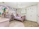 Whimsical bedroom with unicorn themed decor, including a mural and playful accessories at 12822 Plumleaf Dr, Charlotte, NC 28213