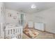 Cozy Bedroom with a teddy bear theme, soft lighting, and coordinated furniture for a warm atmosphere at 12822 Plumleaf Dr, Charlotte, NC 28213
