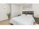 Bedroom with a carpeted floor, a decorative houseplant, and artwork above the headboard at 12822 Plumleaf Dr, Charlotte, NC 28213