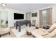 Finished game room with television, foosball table, dart board and comfortable seating at 12822 Plumleaf Dr, Charlotte, NC 28213