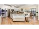 Bright kitchen featuring a granite island with seating, and stainless steel appliances at 12822 Plumleaf Dr, Charlotte, NC 28213