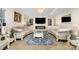 Bright living room showcasing elegant decor, including plush sofas, a fireplace, and modern accents at 12822 Plumleaf Dr, Charlotte, NC 28213