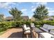Backyard brick patio with outdoor seating and privacy bushes at 13338 Blanton Dr, Huntersville, NC 28078