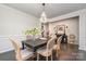 Elegant dining room features a modern chandelier and views into the entry at 13338 Blanton Dr, Huntersville, NC 28078