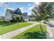 Charming home featuring manicured lawn, beautiful landscaping, a two-car garage and a welcoming entryway at 13338 Blanton Dr, Huntersville, NC 28078