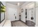 Welcoming foyer with a decorative rug, a bench, and views into other rooms at 13338 Blanton Dr, Huntersville, NC 28078