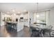 Spacious kitchen with white cabinetry, an island with seating, and stainless steel appliances at 13338 Blanton Dr, Huntersville, NC 28078