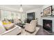 Comfortable living room with a fireplace, plush seating, and neutral decor at 13338 Blanton Dr, Huntersville, NC 28078