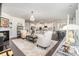 Open-concept living room featuring hardwood floors, modern decor, and natural light at 13338 Blanton Dr, Huntersville, NC 28078