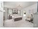 Spacious main bedroom features a decorative chandelier, sitting area, and ensuite bathroom at 13338 Blanton Dr, Huntersville, NC 28078