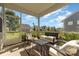 Screened porch with patio furniture, garden view, and neighborhood view at 13338 Blanton Dr, Huntersville, NC 28078