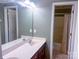 Bathroom featuring a double sink vanity and a separate shower and tub area at 15494 Donnington Dr, Charlotte, NC 28277