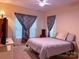 Cozy bedroom with a plush bed, soft lighting, and window with stylish curtains at 15494 Donnington Dr, Charlotte, NC 28277