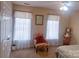 Bright bedroom featuring ample natural light, a decorative chair, and stylish furnishings at 15494 Donnington Dr, Charlotte, NC 28277