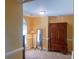 Bedroom showcasing a classic armoire, a floor lamp, and natural light at 15494 Donnington Dr, Charlotte, NC 28277