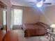Bedroom featuring natural light, with an accent window, ample room and comfortable furnishings at 15494 Donnington Dr, Charlotte, NC 28277