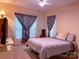 Cozy bedroom with a comfortable bed, curtains, and plenty of natural light at 15494 Donnington Dr, Charlotte, NC 28277