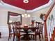 Formal dining room with a decorative ceiling, chandelier, and seating for six at 15494 Donnington Dr, Charlotte, NC 28277