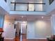 Spacious hallway with hardwood floors, leading to the front door and upper level at 15494 Donnington Dr, Charlotte, NC 28277