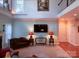 Comfortable living area with a fireplace and large windows, perfect for relaxing at 15494 Donnington Dr, Charlotte, NC 28277