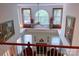 Open concept living room with a decorative fireplace and large windows for natural light at 15494 Donnington Dr, Charlotte, NC 28277