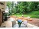 Enjoy outdoor gatherings on the patio with mature trees, an outdoor kitchen, and a relaxing atmosphere at 1571 10Th Street Nw Pl, Hickory, NC 28601