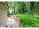 Private backyard featuring a brick patio with an outdoor lounge area and lush green lawn at 1571 10Th Street Nw Pl, Hickory, NC 28601