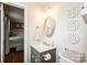 Bathroom with a vanity sink, mirror, decorative accents, and adjacent bedroom view at 1571 10Th Street Nw Pl, Hickory, NC 28601