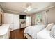 Comfortable bedroom featuring hardwood floors, a mounted TV, and ample closet space at 1571 10Th Street Nw Pl, Hickory, NC 28601