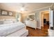Comfortable bedroom with neutral walls, hardwood floors, and white furnishings at 1571 10Th Street Nw Pl, Hickory, NC 28601