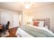 Spacious bedroom with hardwood floors, comfortable bed, and cozy furnishings at 1571 10Th Street Nw Pl, Hickory, NC 28601
